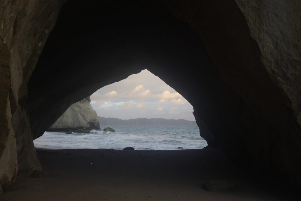 cathedral cove through cave brooding weather